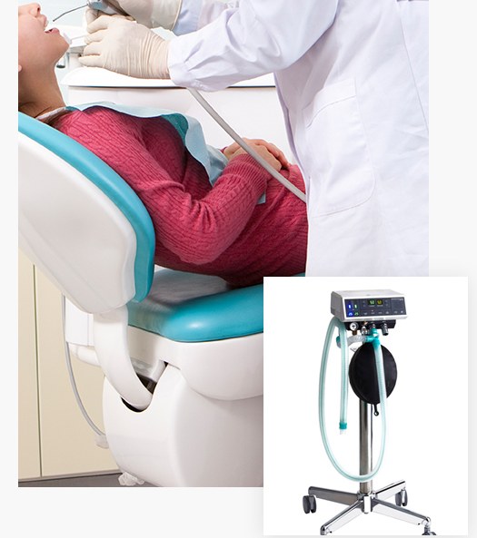 Patient receiving treatment in the dental chair and the nitrous oxide sedation unit